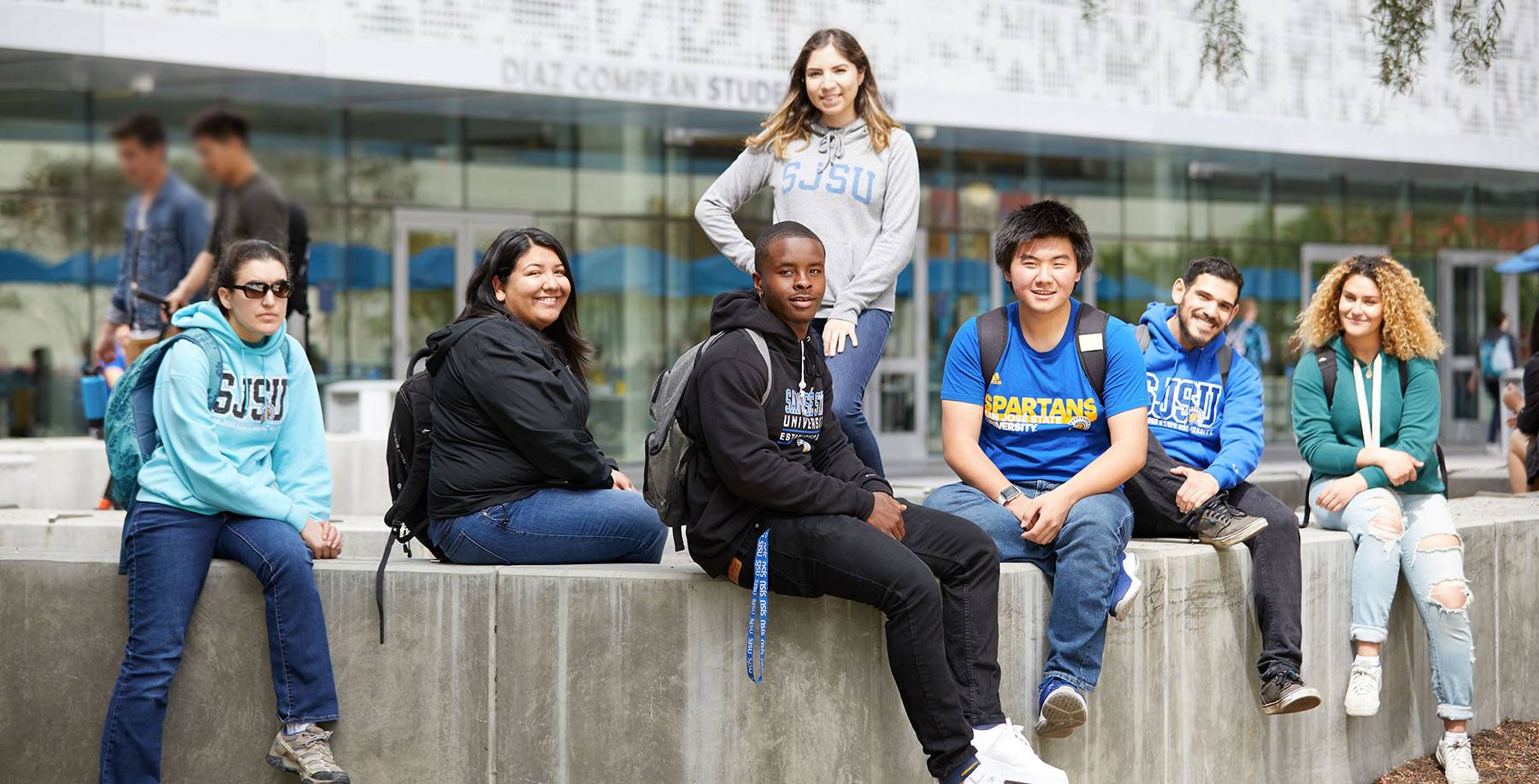 students sitting in front of the student union.