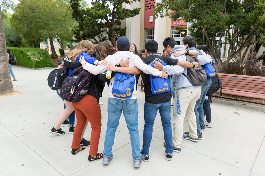 SJSU students embracing during Frosh Orientation.