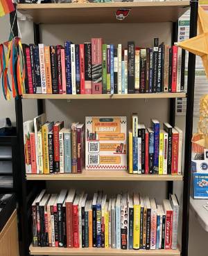 Photo of bookshelf in CAPISE full of books