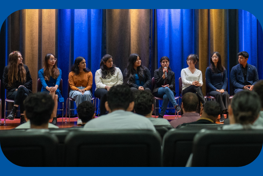 Business Honors Program Ambassadors sharing their experience at an info night in the Student Union Theater