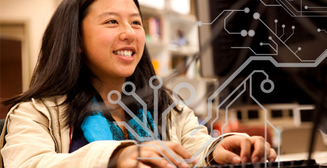 student at table on computer