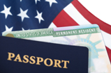 A pasport in the forground with an american flag in the background.