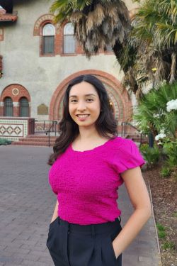 Melissa standing in front of a building at SJSU