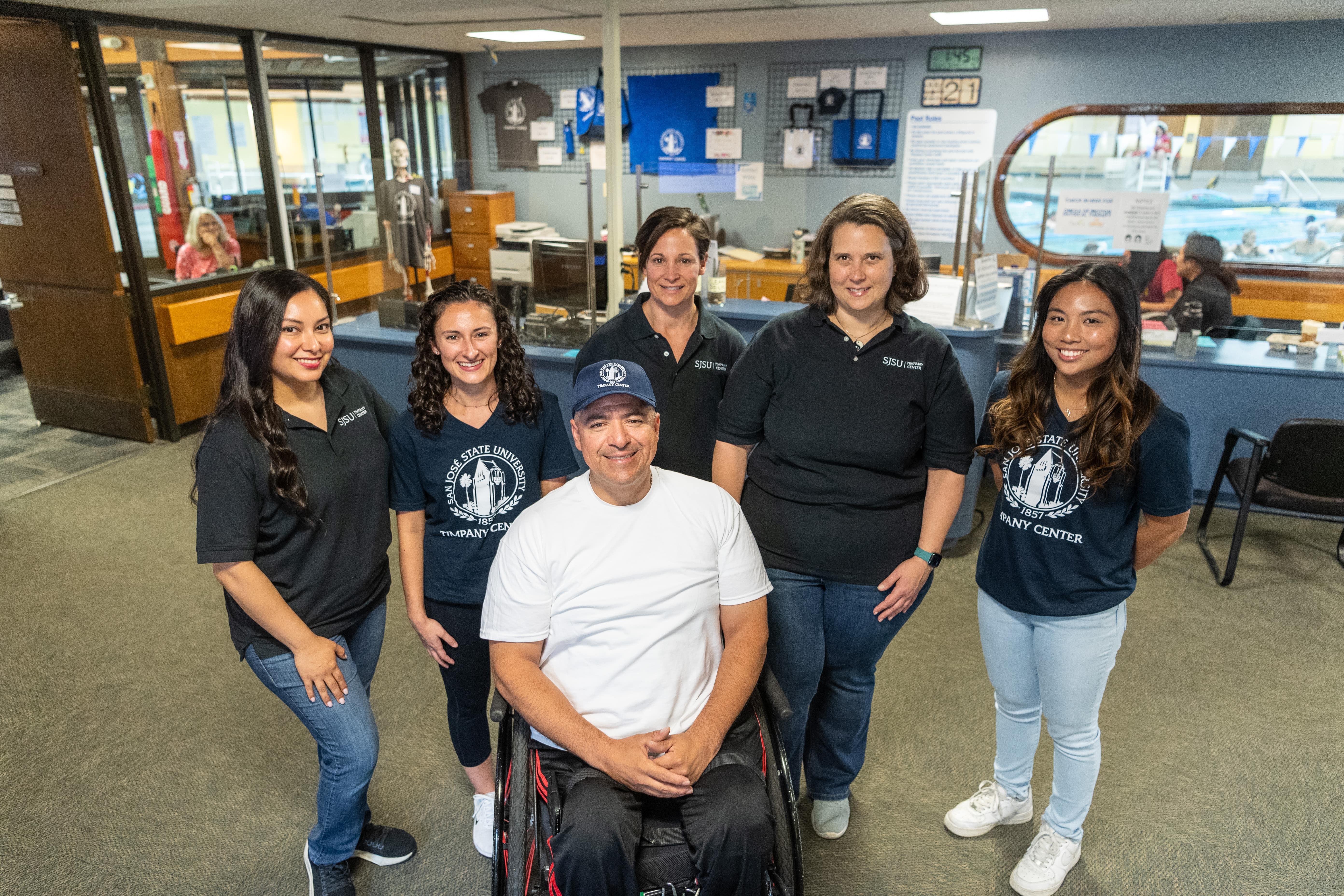 Timpany Center staff and clients have weathered many storms together. From left: staff members Carina Rodriguez-Tsai and Maranda Amaral, client Felipe Gonzalez, staffer Brittany Manrubia, program and operations director Jennifer Schachner, and staffer Kelsey Basilio. Photo: Robert C. Bain.