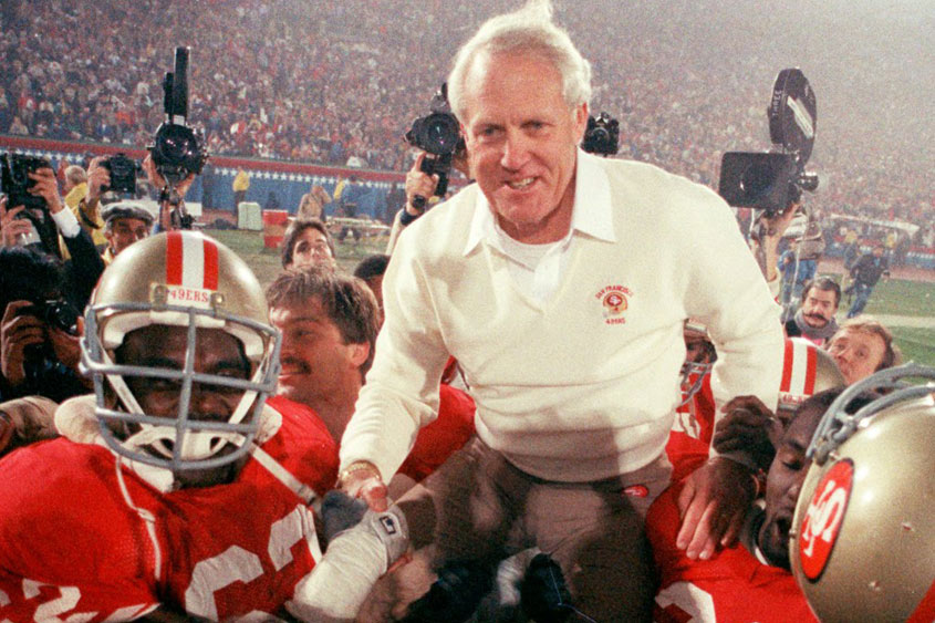 Bill Walsh being carried on the shoulders of the football team.