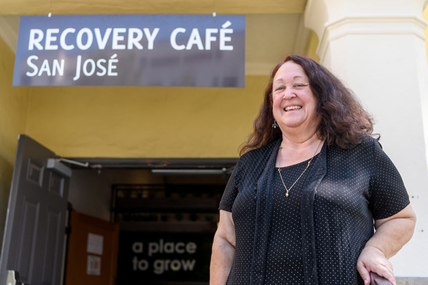 Kathy Cordova standing in front of the Recovery Cafe..